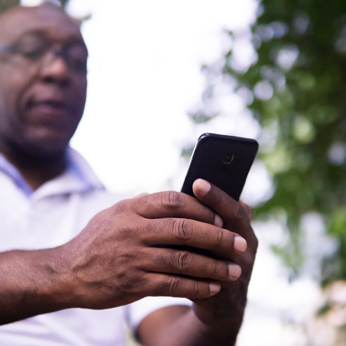 Aftrican American man using his cellphone