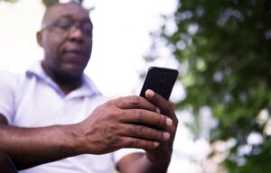 Aftrican American man using his cellphone