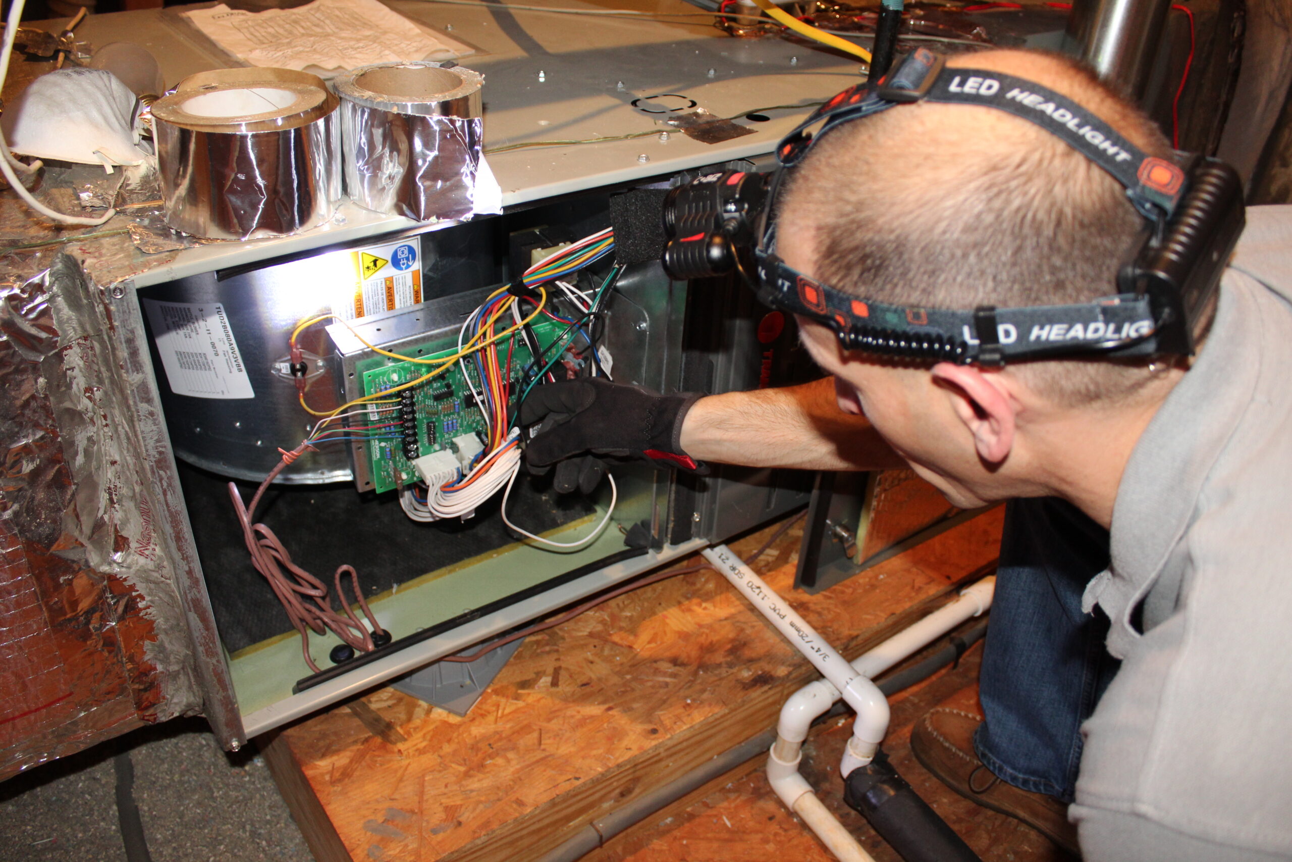 HVAC Professional working on air handler