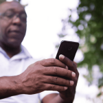 Aftrican American man using his cellphone